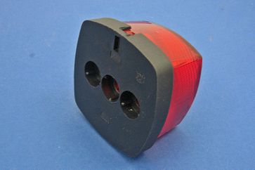 Tail lamp - rubber-mounted black plastic base with red lens