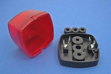 Tail lamp - rubber-mounted black plastic base with red lens