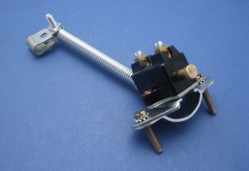 Mechanical switch with spring and clamp