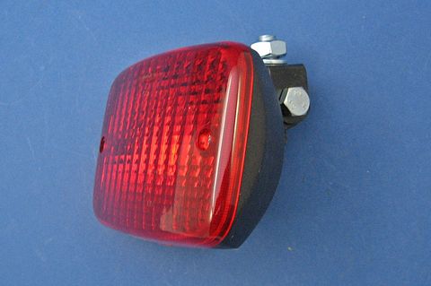 Rear fog lamp mounted on an adjustable steel bracket