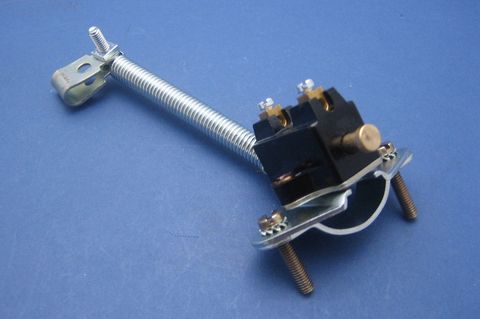 Mechanical switch with spring and clamp